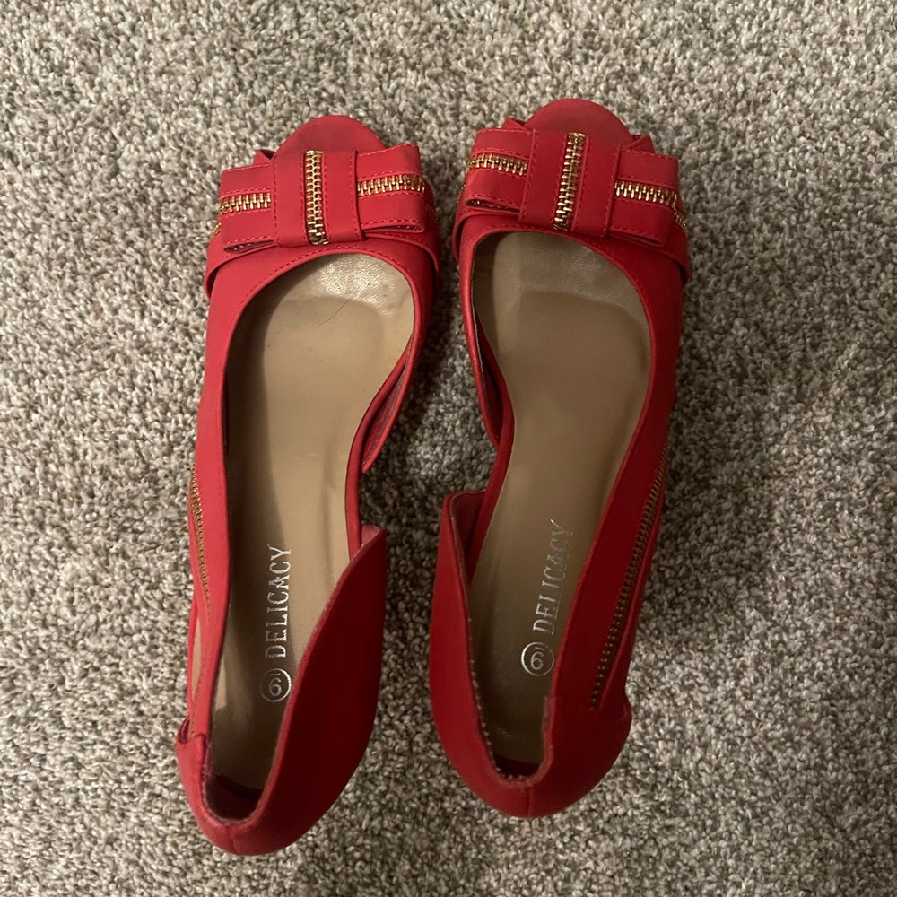 Red heel pumps